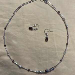 18 inch or less necklace with purple and iridescent beads. Matching earrings